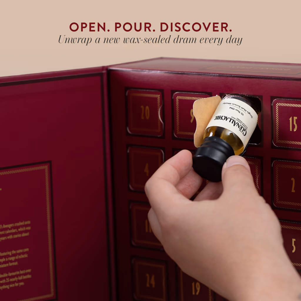 A hand pulling a wax-sealed dram from an open door