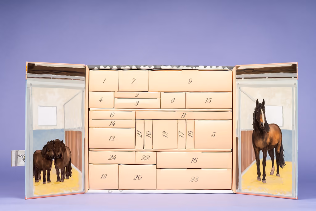 The stable doors open on 24 numbered drawers, with painted horses inside each door