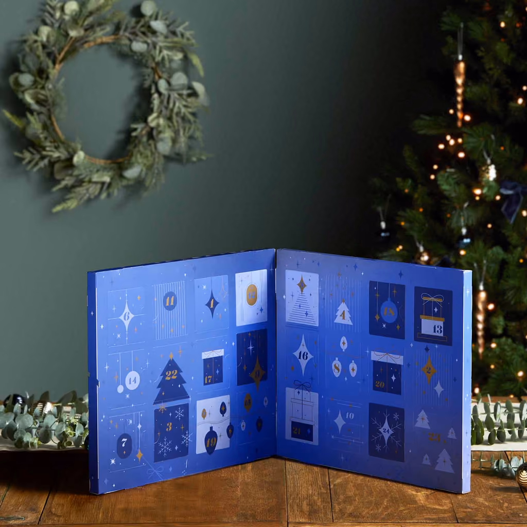 The Twinings calendar opened out beside a Christmas tree