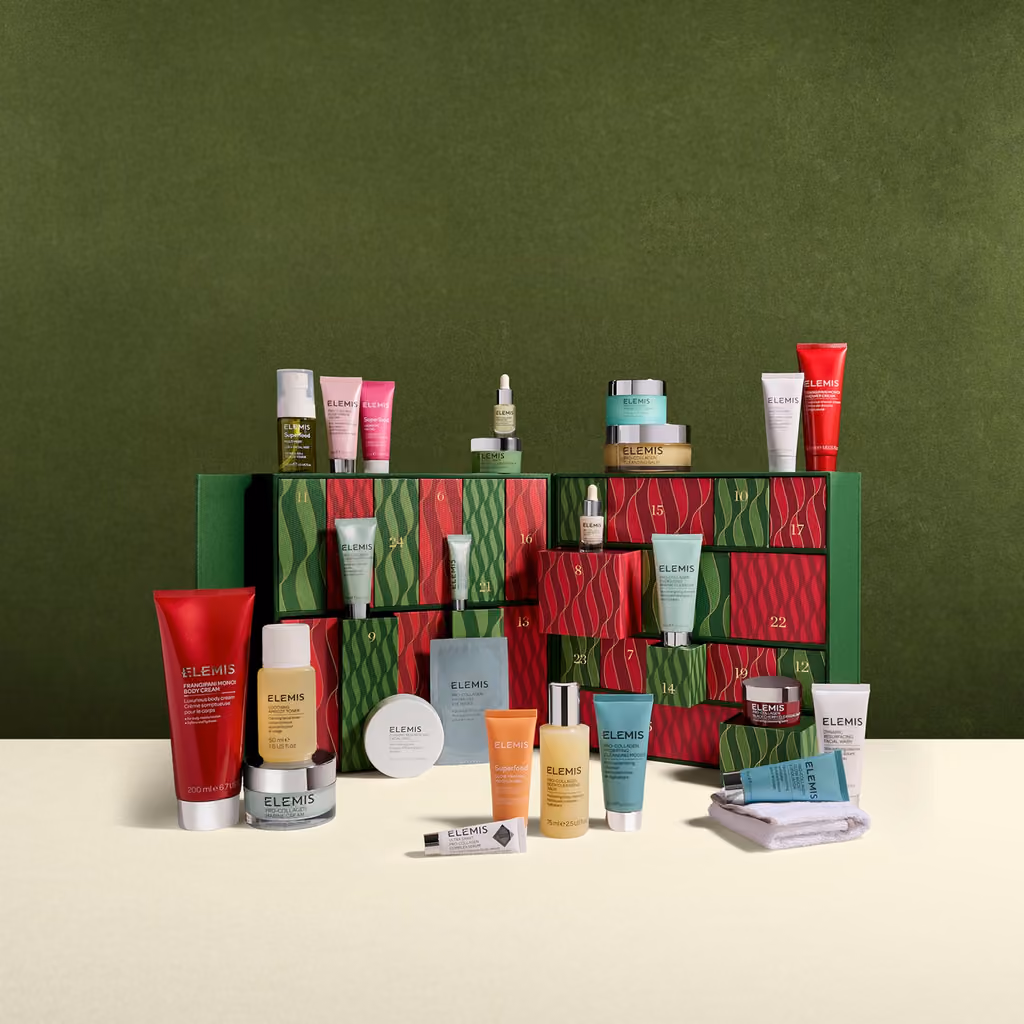 The box open on a green set with the products spilling out of the drawers