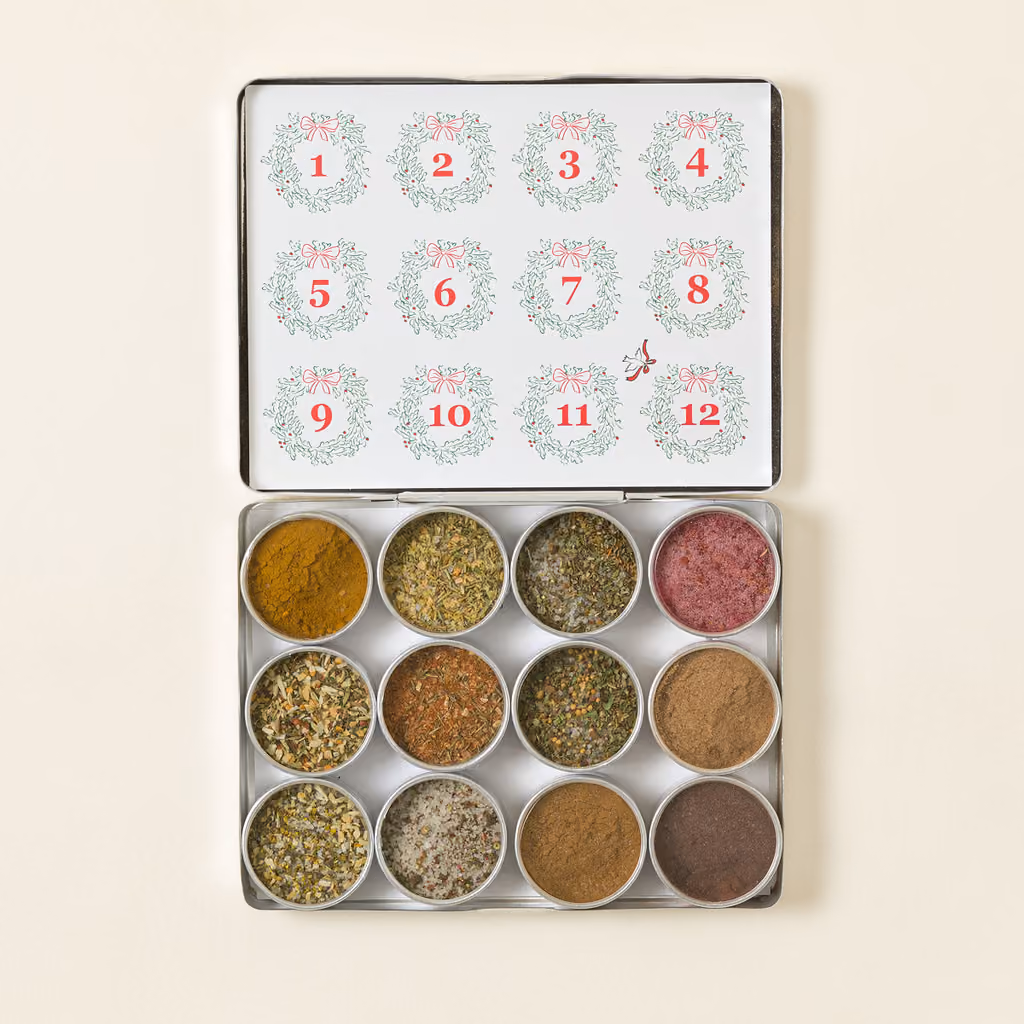 Twelve open tins of spice under the numbered lid