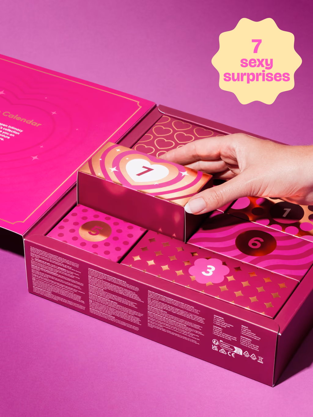 A hand lifting a numbered drawer out of the pink Romance box