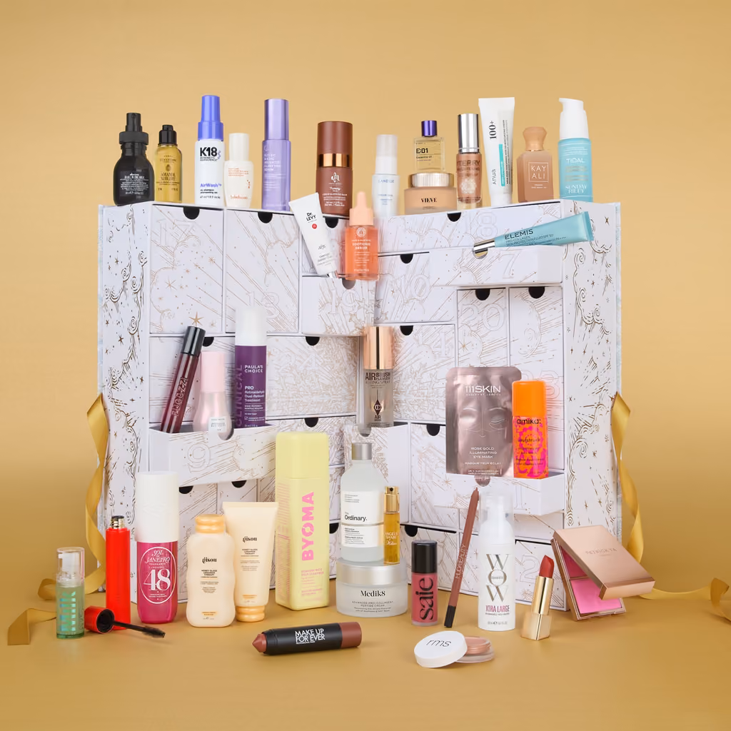 The Special Edition box open on gold, products standing on and in front of its drawers