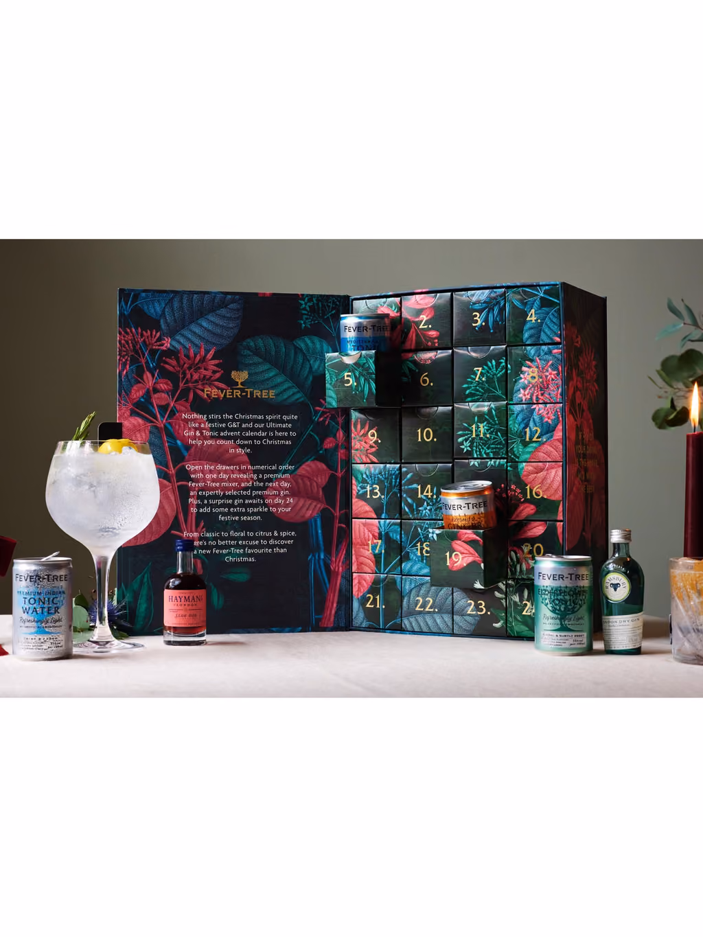 The open calendar beside a gin and tonic with a lemon twist