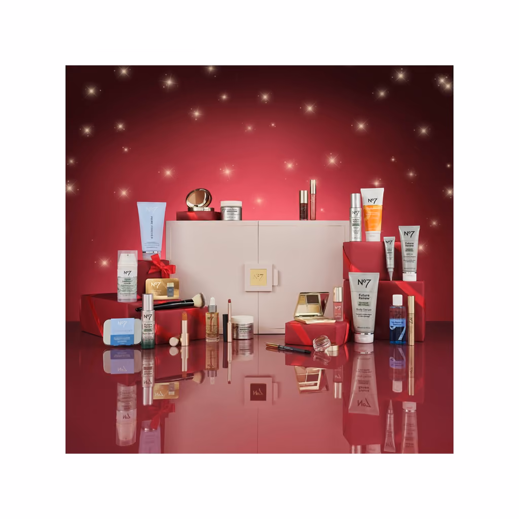 The No7 Ultimate box on a red set with its products around it