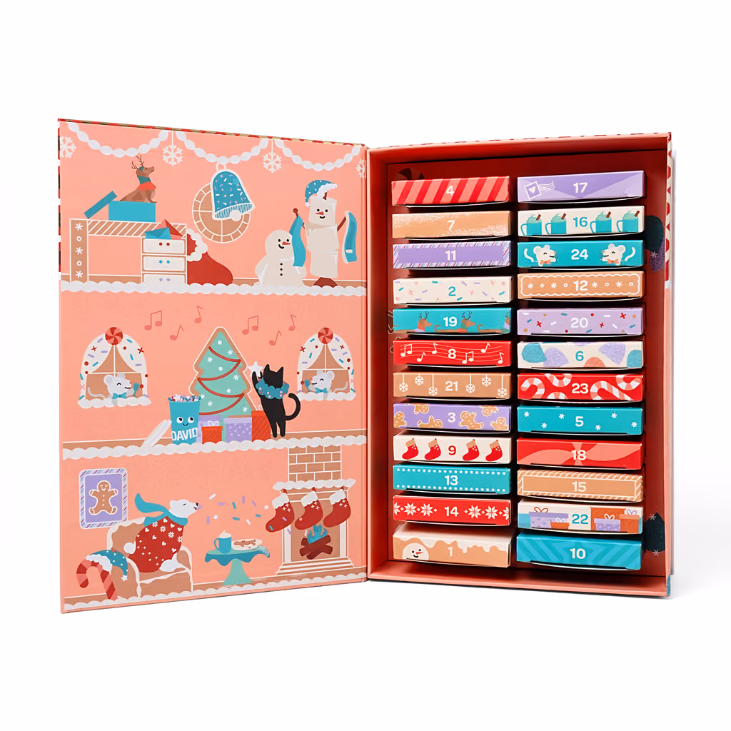 The gingerbread house box open, drawers in two columns