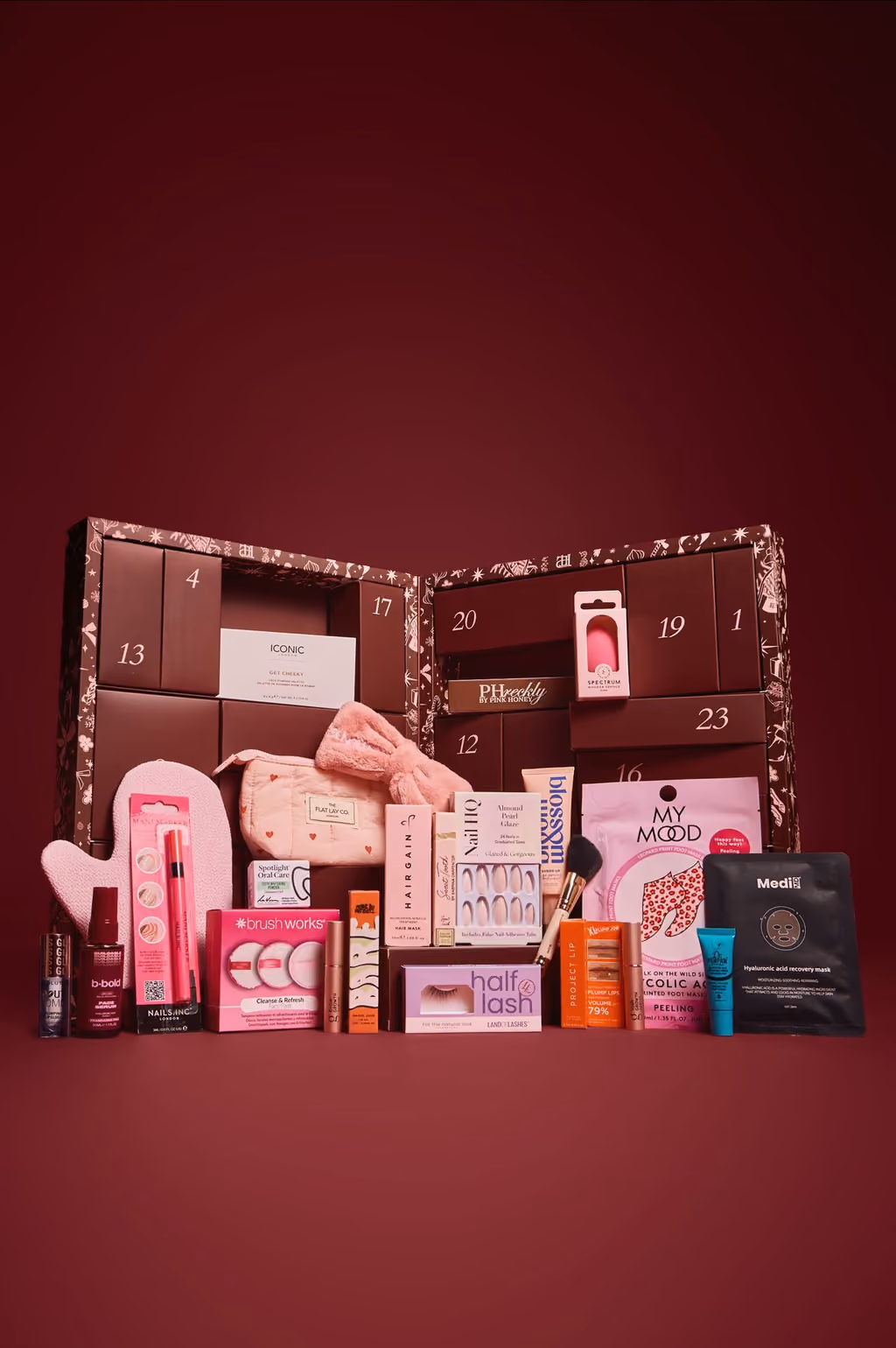 The PrettyLittleThing beauty advent calendar open with its 24 pieces