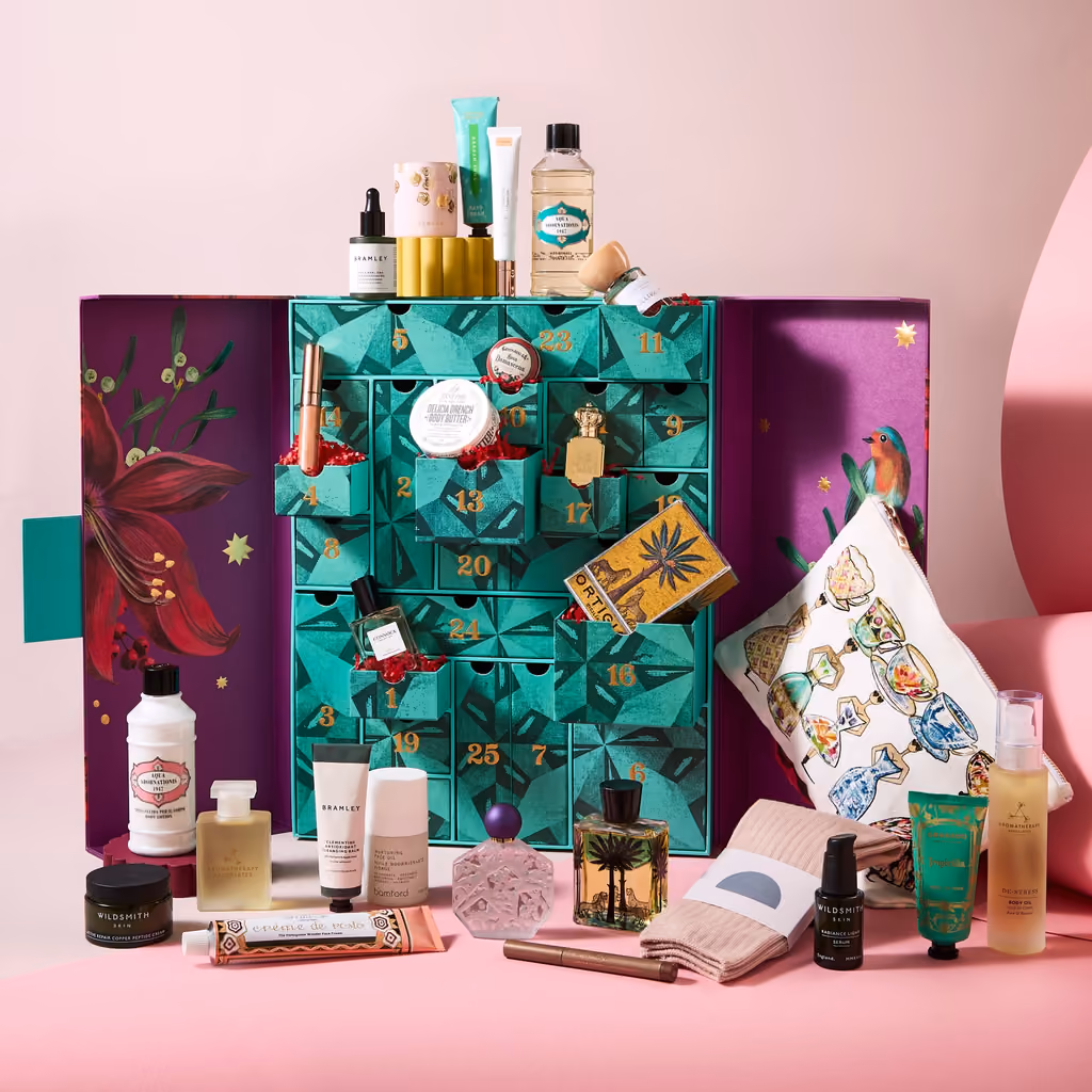 The box fully open, its 25 drawers and the products around it