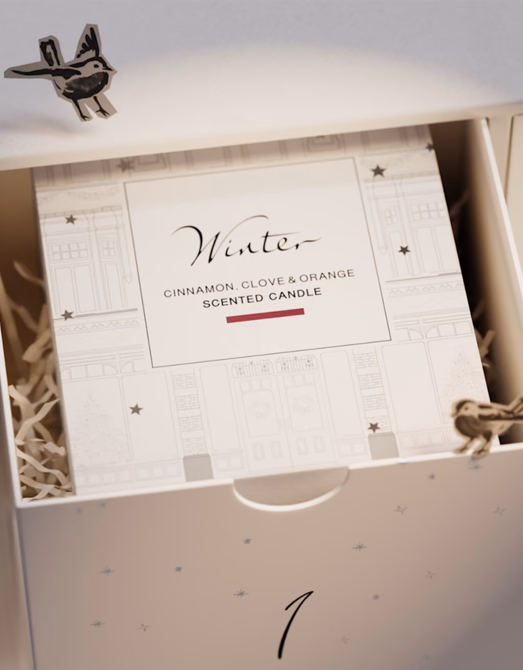 A drawer pulled open to show the Winter candle inside