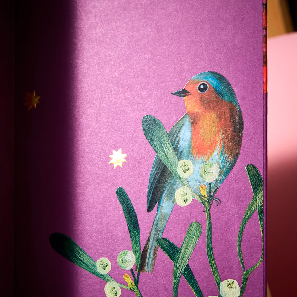 The robin painted on the side of the box