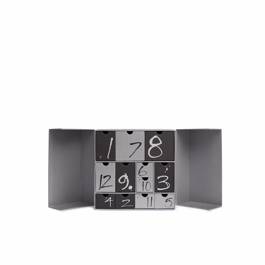 Both doors open on the 12 numbered silver and black drawers