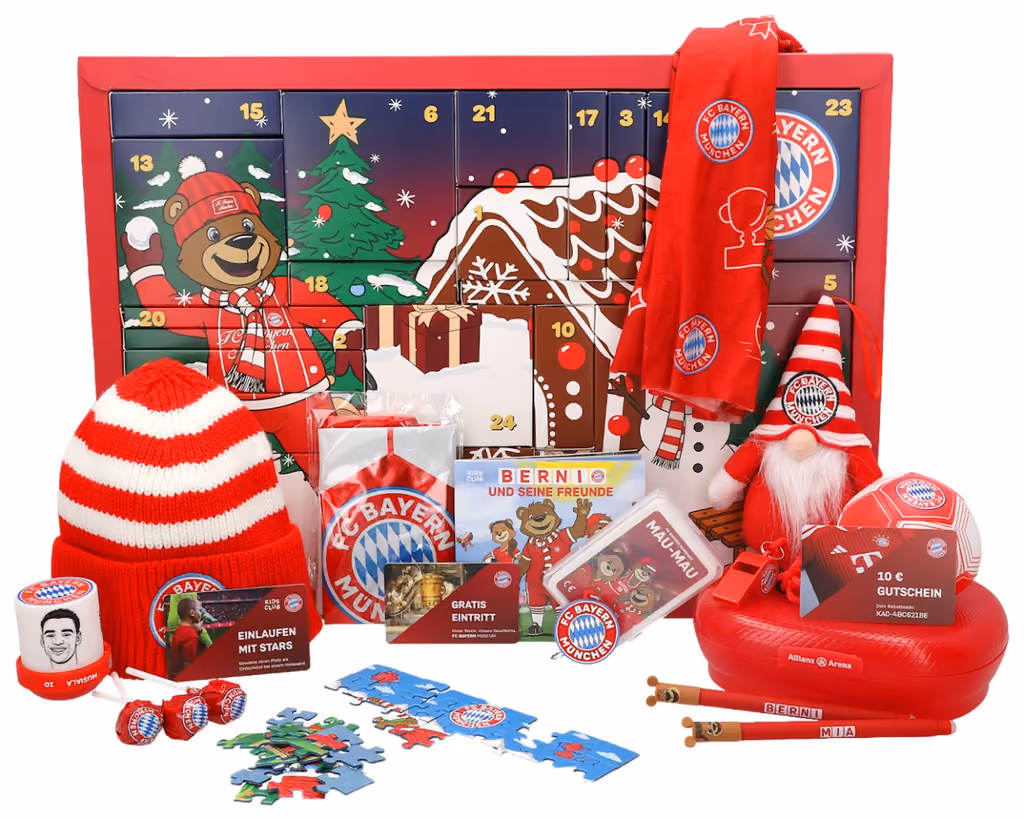 The hat, scarves, gnome, lunch box, card games, jigsaw, book and lollipops laid out in front of the box