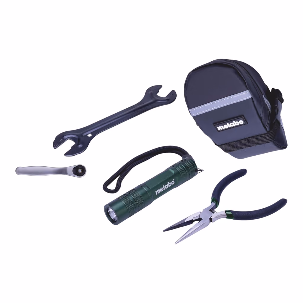 A cone spanner, mini ratchet, torch, needle-nose pliers and the Metabo saddle bag on white