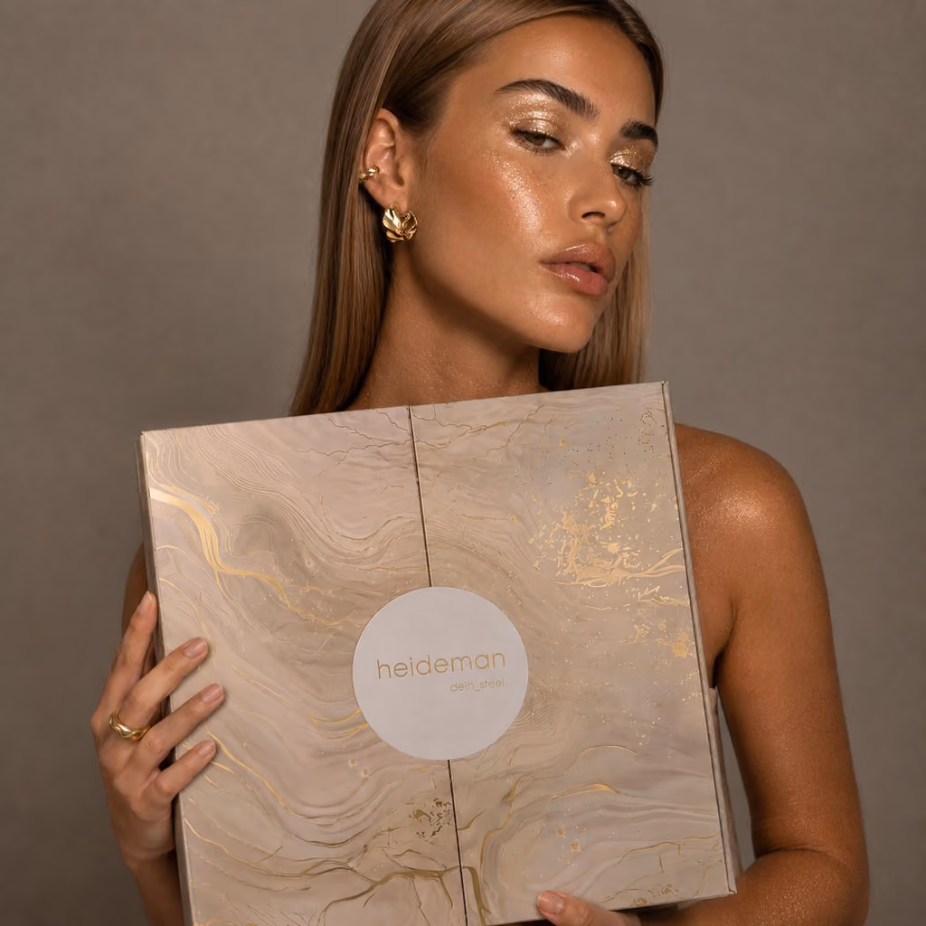 The closed marbled box held in two hands