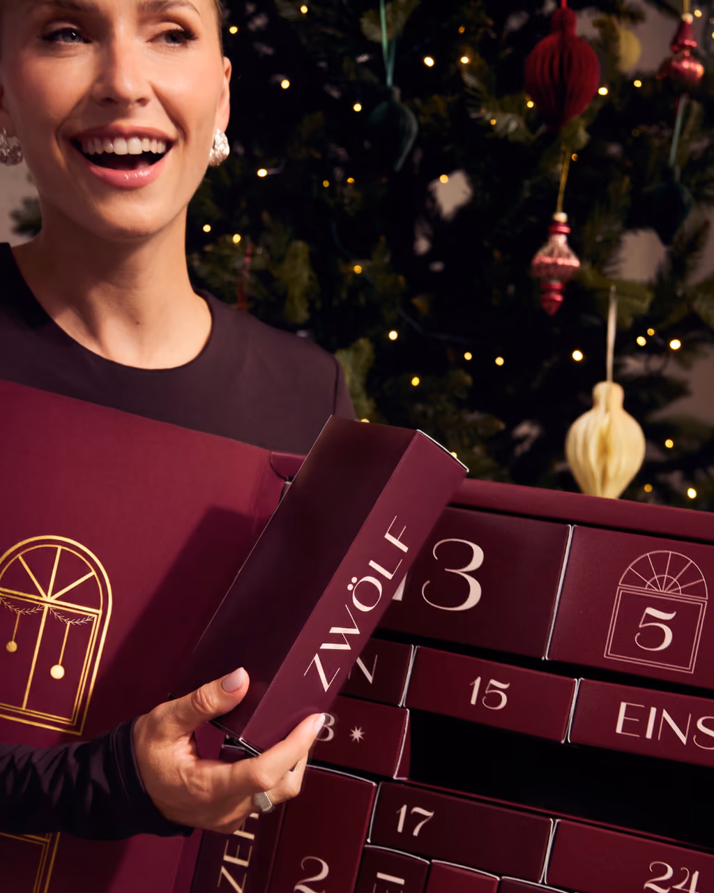 Lena Gercke opening a drawer of the 2026 calendar