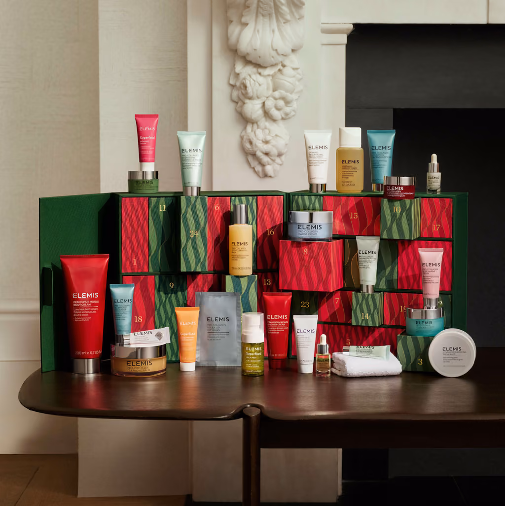 The calendar and its products on a wooden table in front of a fireplace