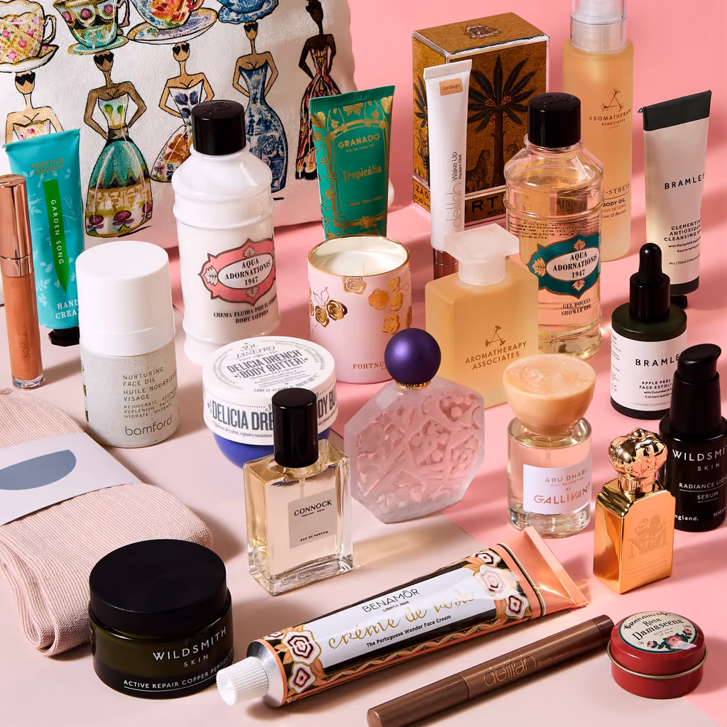 The 25 products laid out together on pink