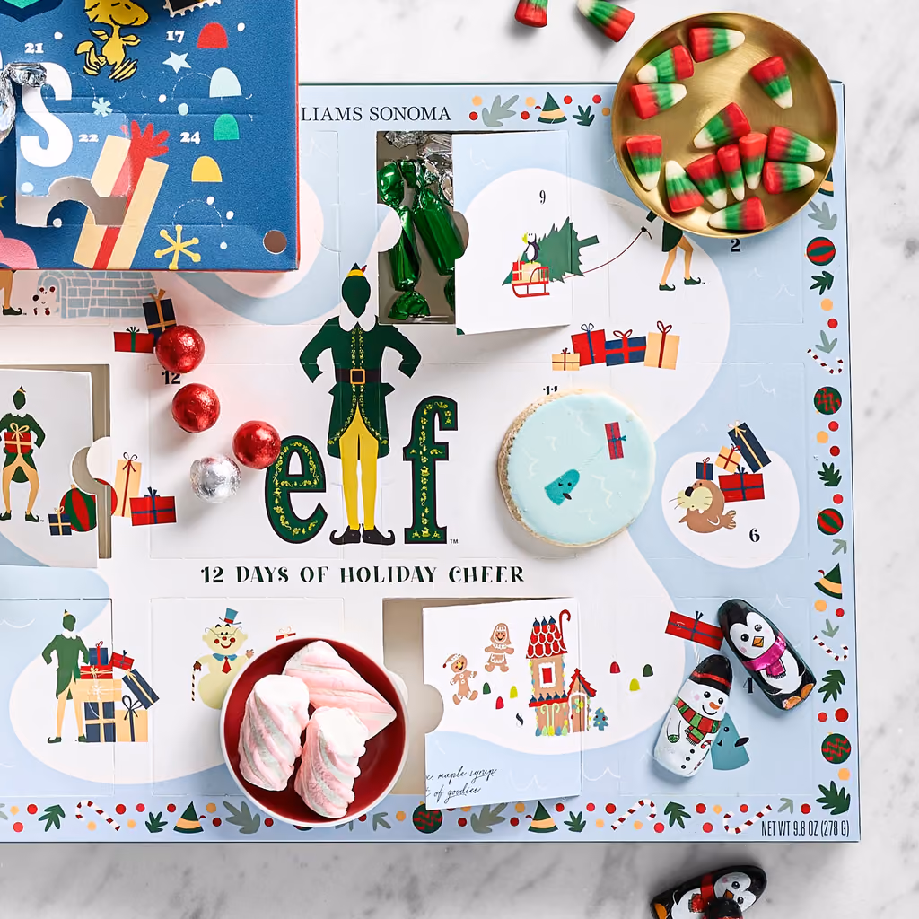 The Elf x Williams Sonoma advent calendar styled with the treats around it