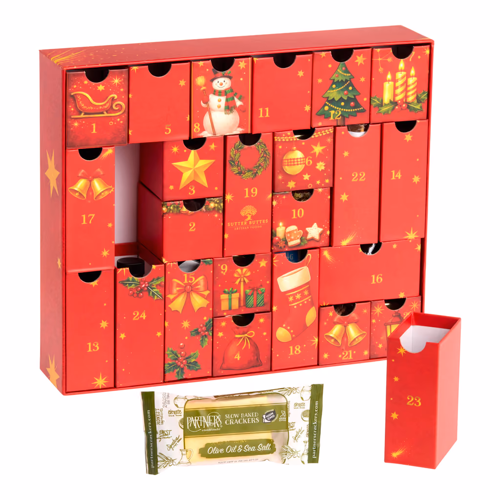 The red drawer chest with drawers pulled open and a cracker packet in front