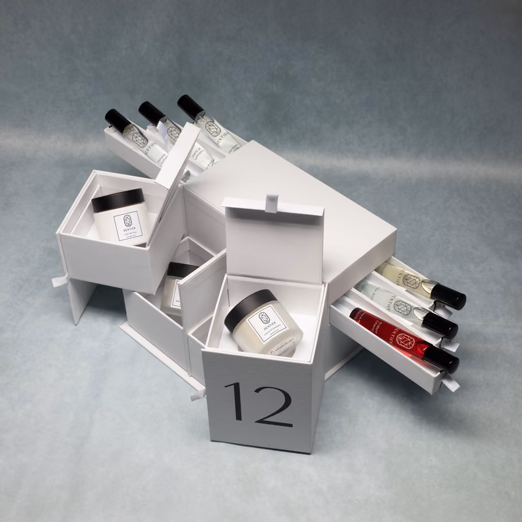 Numbered drawers pulled open, a candle in one and sprays in another