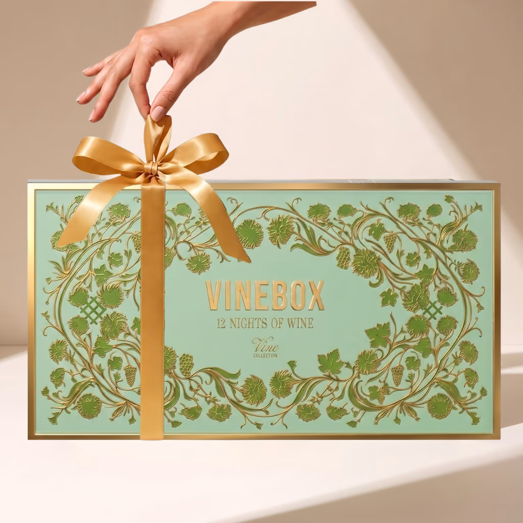The mint-green Vine Collection box tied with a gold bow