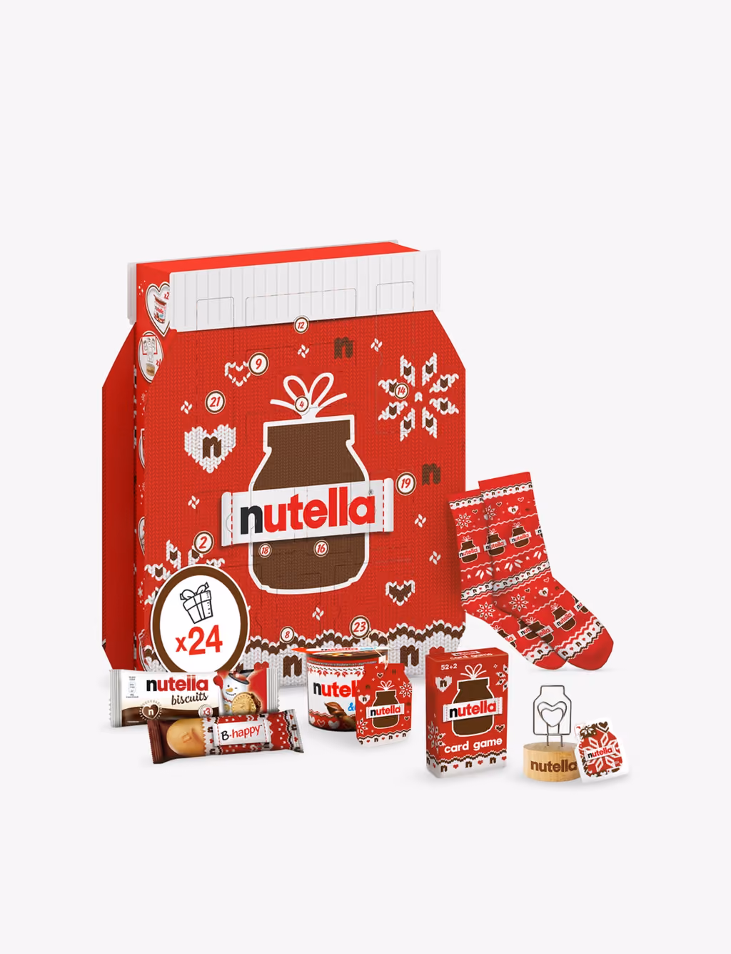 The knitted-jumper box with socks, a card game, biscuits and a Nutella & Go pot in front of it