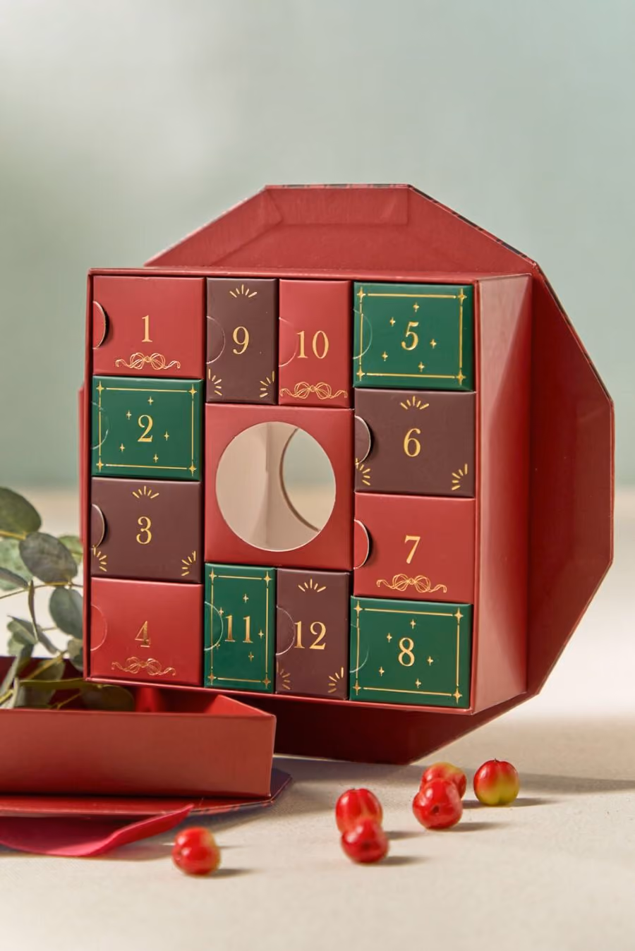 The wreath box with its lid off and the twelve numbered compartments closed