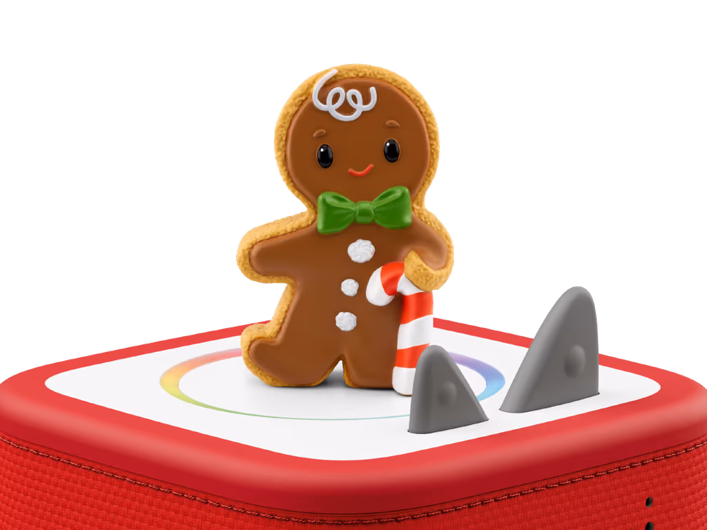 The gingerbread-man Tonie standing on a red Toniebox