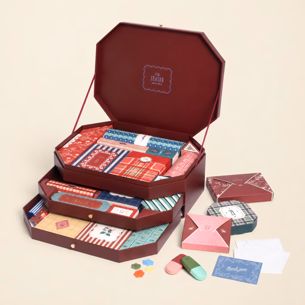 The 24 Day box open, its three drawers out and the stationery in front