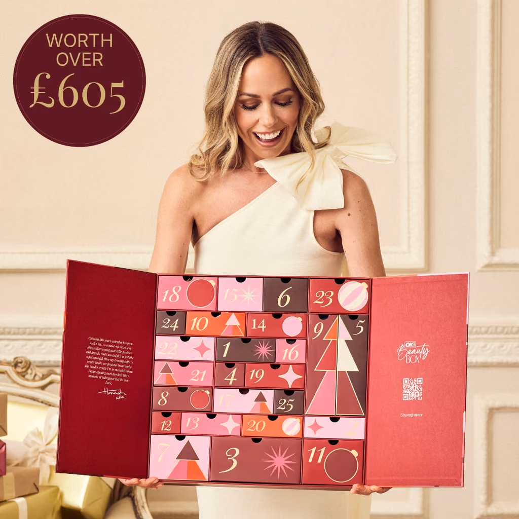 The OK! Beauty Box advent calendar open, held by Hannah Martin