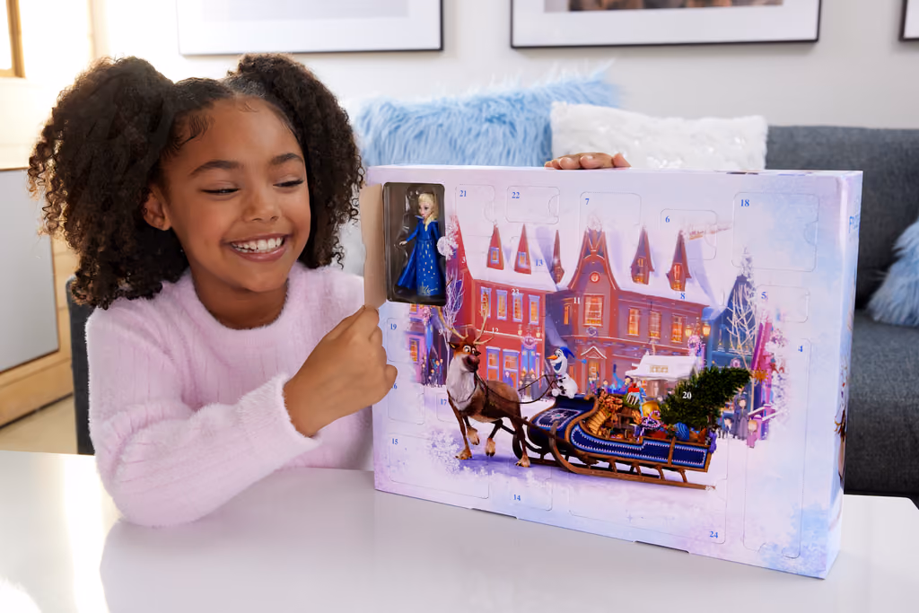 Disney Frozen Advent Calendar 2025, a child with the box