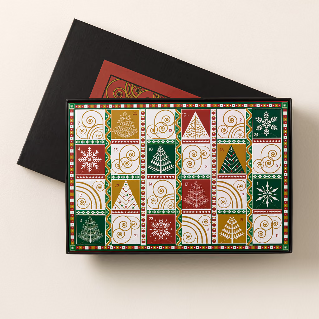The patterned tray of 24 compartments in its black box