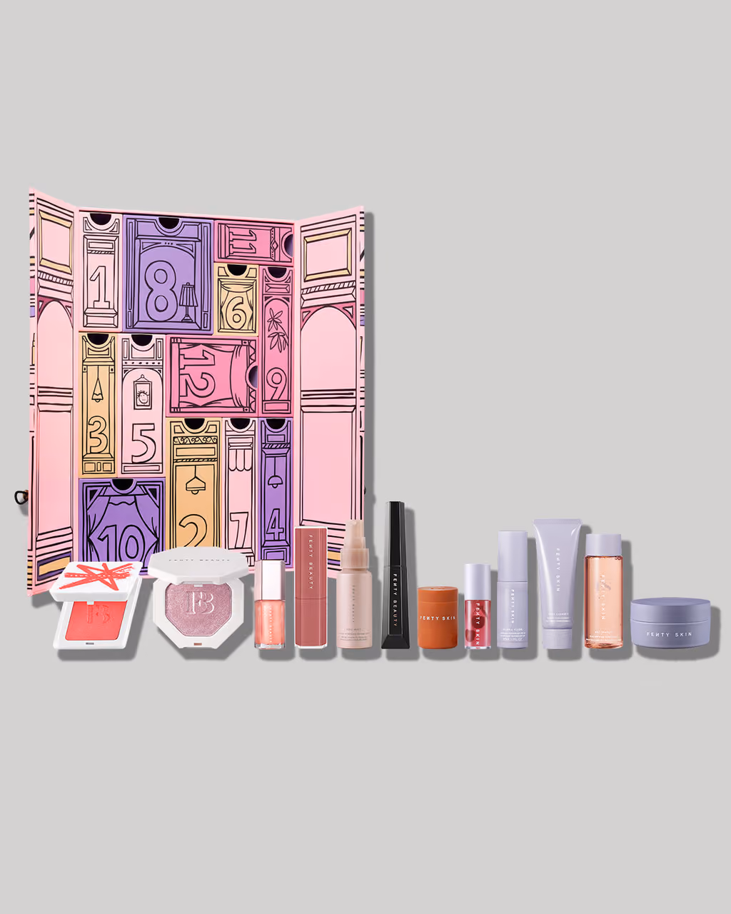 The pink box opened onto its drawers, the twelve Fenty Beauty and Fenty Skin products lined up in front