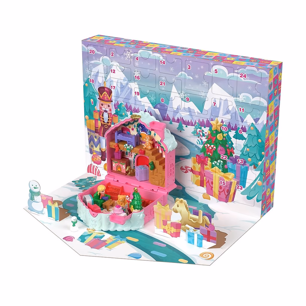 The calendar box standing open with the gingerbread compact unfolded into a cabin playset in front