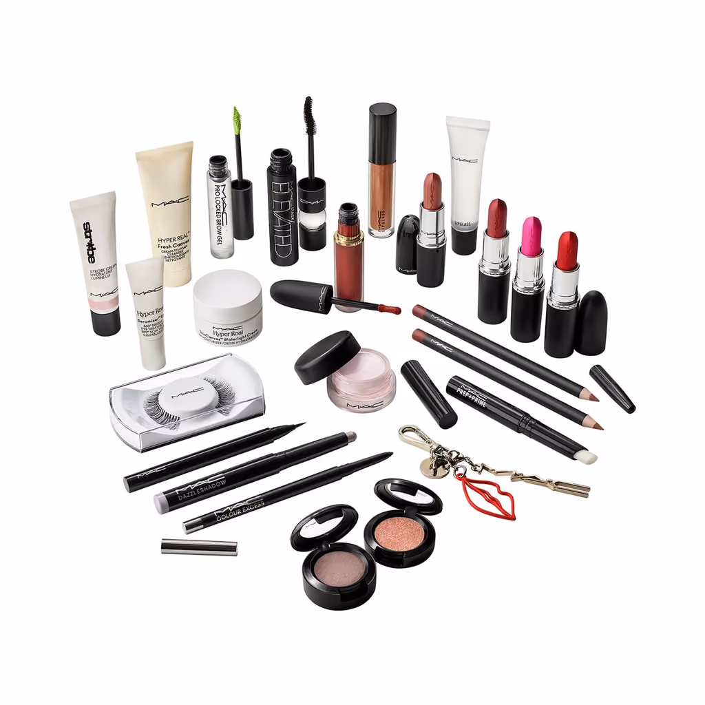 The lipsticks, glosses, pencils, eyeshadows, lashes and skincare tubes laid out on white