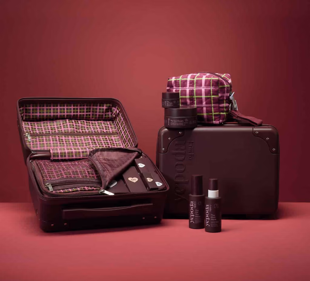 The Yepoda 2026 calendar suitcase open, showing the numbered doors inside