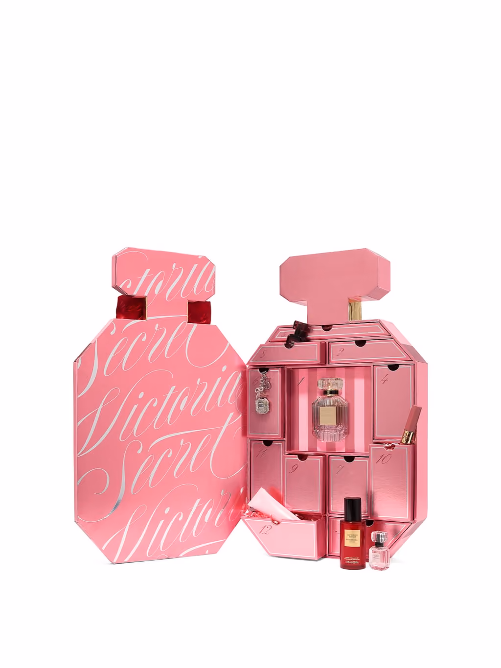 The bottle-shaped box swung open on its hinge, pink drawers inside with a perfume and a gloss showing