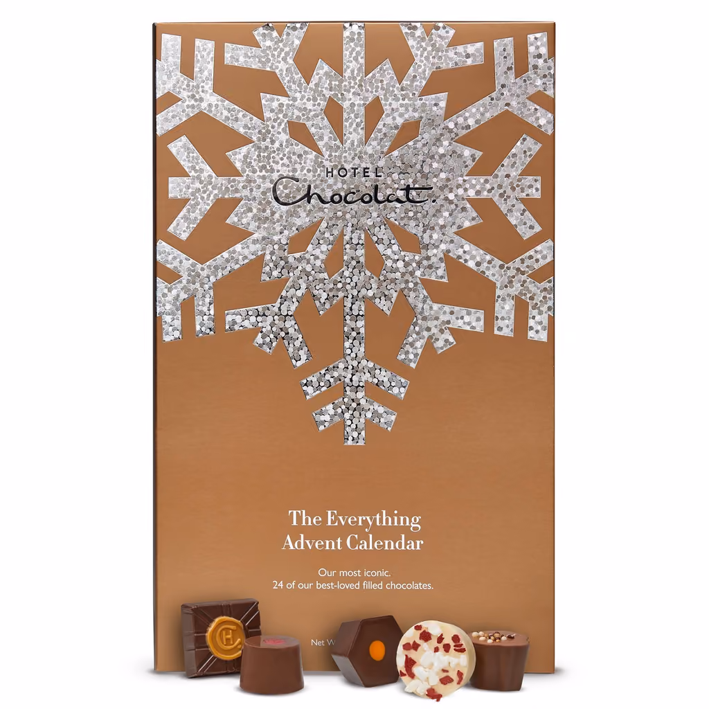 The closed box with chocolates in front of it