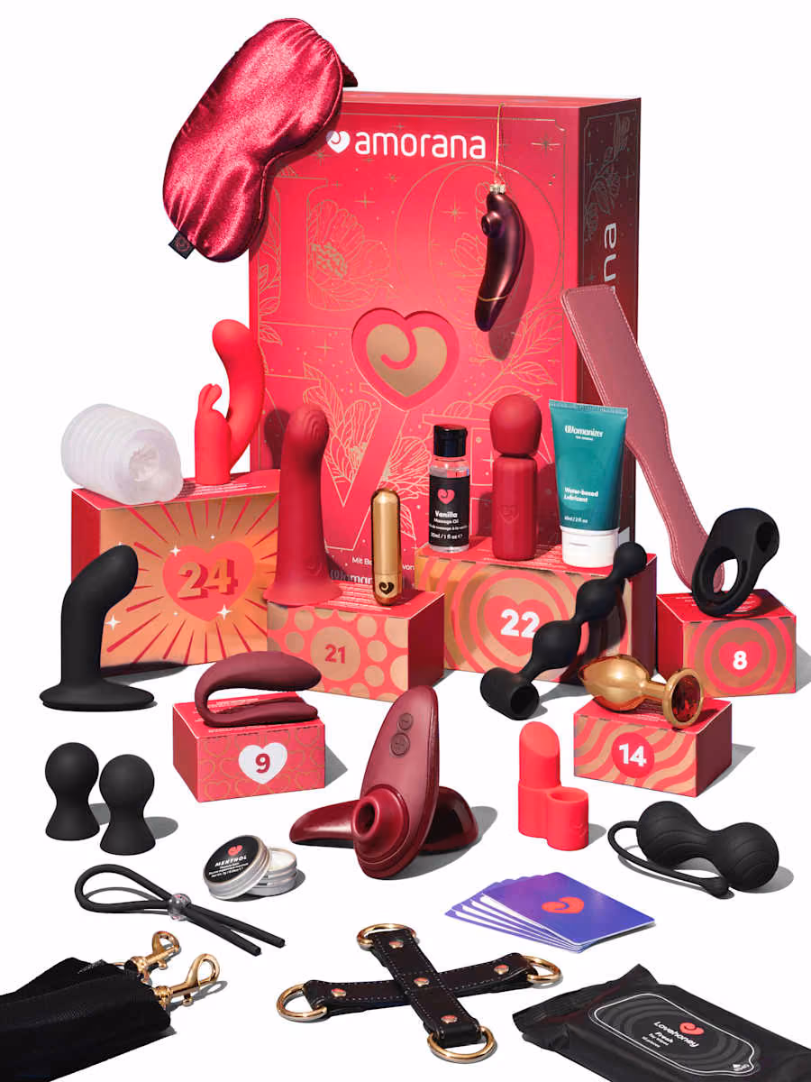 All 24 toys, cuffs, oils and accessories arranged around the closed box