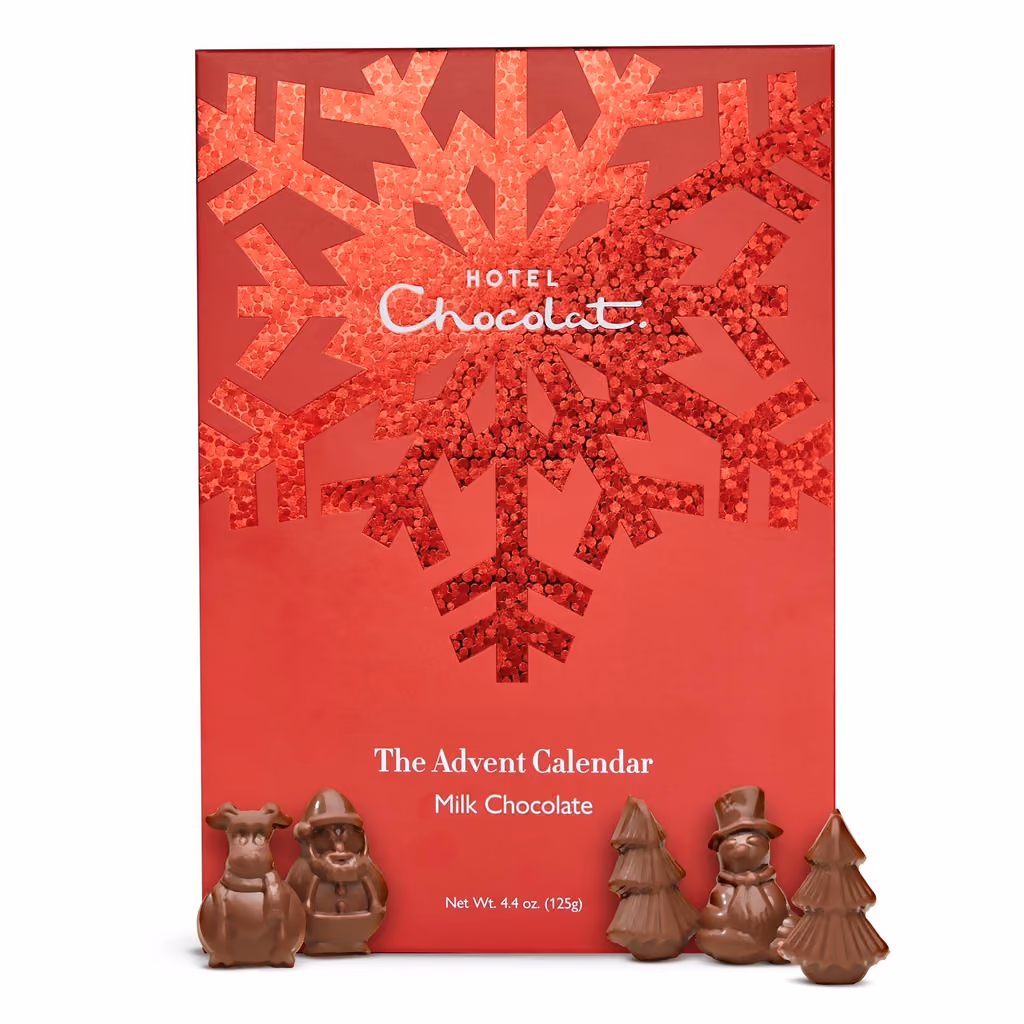 The closed box with chocolates in front of it