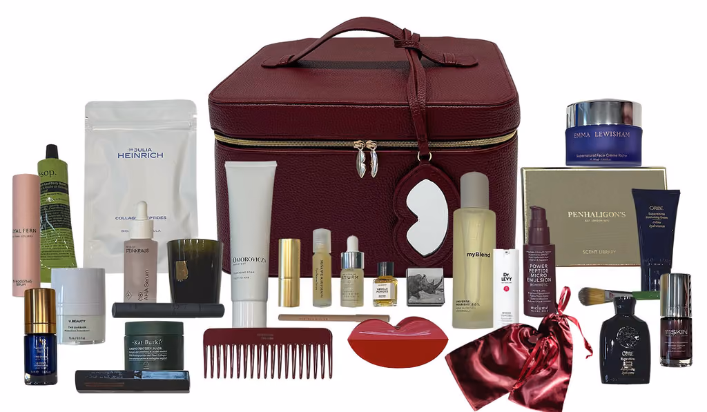 The Niche Beauty Luxury 2026 beauty case open, showing the satin pouches inside