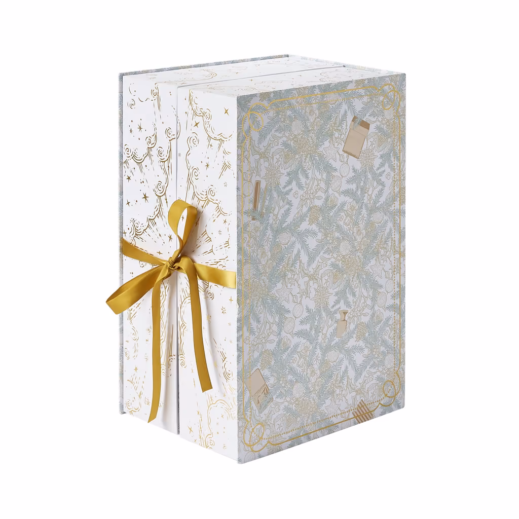 The Special Edition box closed on white, tied with gold ribbon
