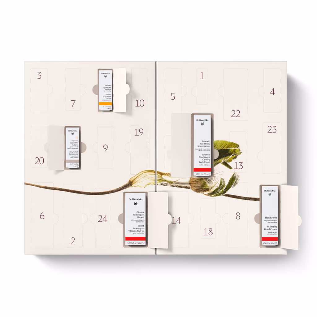 The open Dr. Hauschka bliss calendar with five products pulled from their doors
