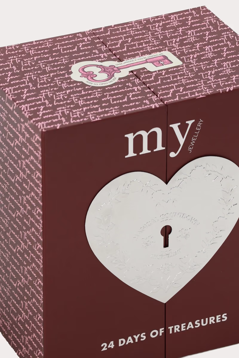 The burgundy box from the corner, with the key motif on the lid