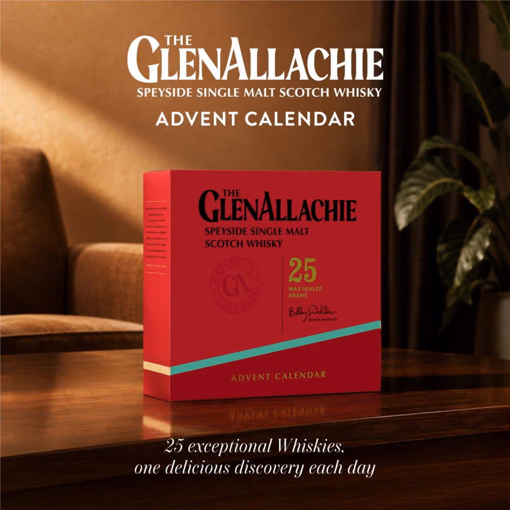The red GlenAllachie box on a wooden side table in a lamp-lit room