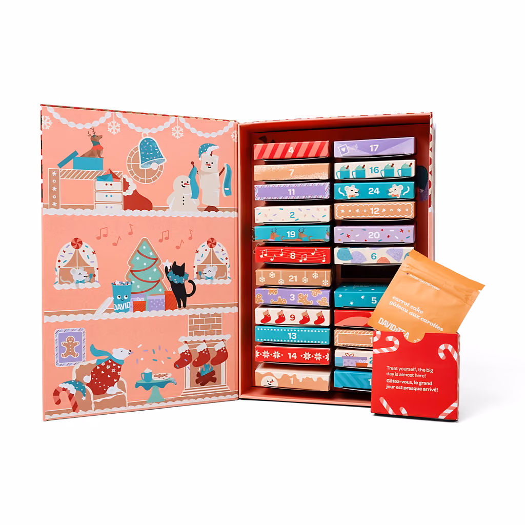 The box opened like a book onto its 24 numbered drawers, one drawer pulled out with a tea pouch